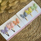 Klikklak clips in pastel kleuren op gouden haarclips